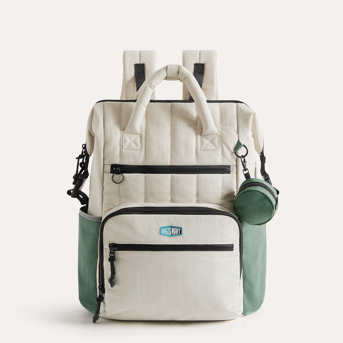 Cream and green Paz 25L travel diaper backpack with multiple zippered compartments, padded handles, and side bottle holders